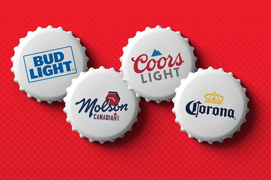 Collection of beer bottle caps on red background.