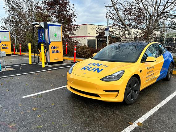 EV vehicle parked next to charger.