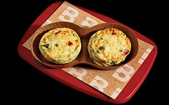 Fluffy two-bite egg white omelettes with sweet red bell peppers, spinach, onions, and cheddar cheese.