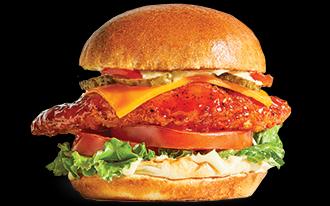 Crispy chicken breast. Nashville hot sauce. Lettuce. Tomato. Cheese. Pickles. Hot peppers drizzled in garlic aioli.