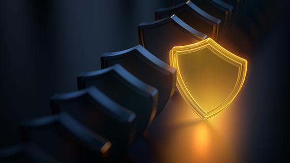 Collection of shield icons with one glowing gold.